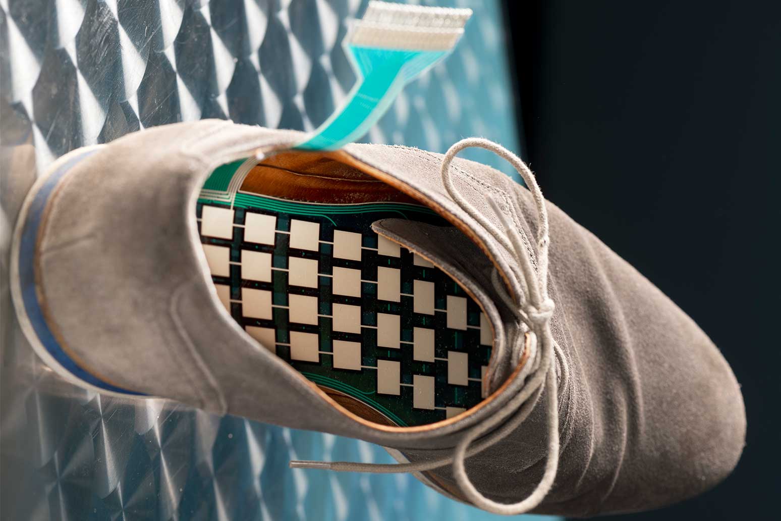 Sensor system for monitoring pressure spots in a shoe